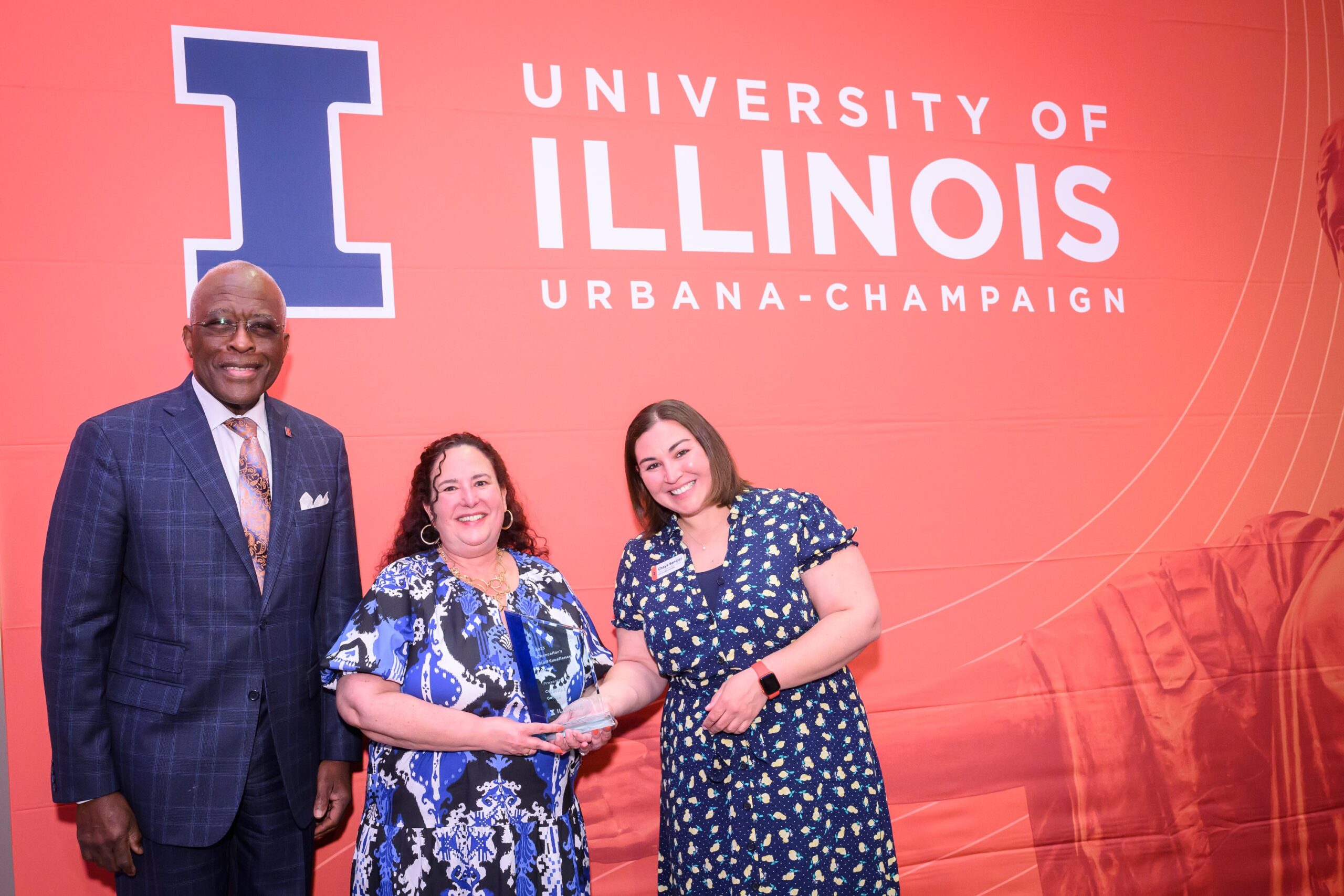 Cordelia Geiken stands with Chancellor Robert J. Jones and receives the award