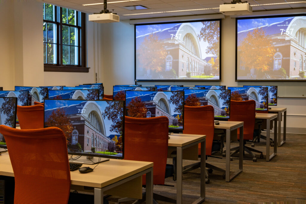 Computer lab at Armory room 146 available with screens, desks, computers and other equipment.